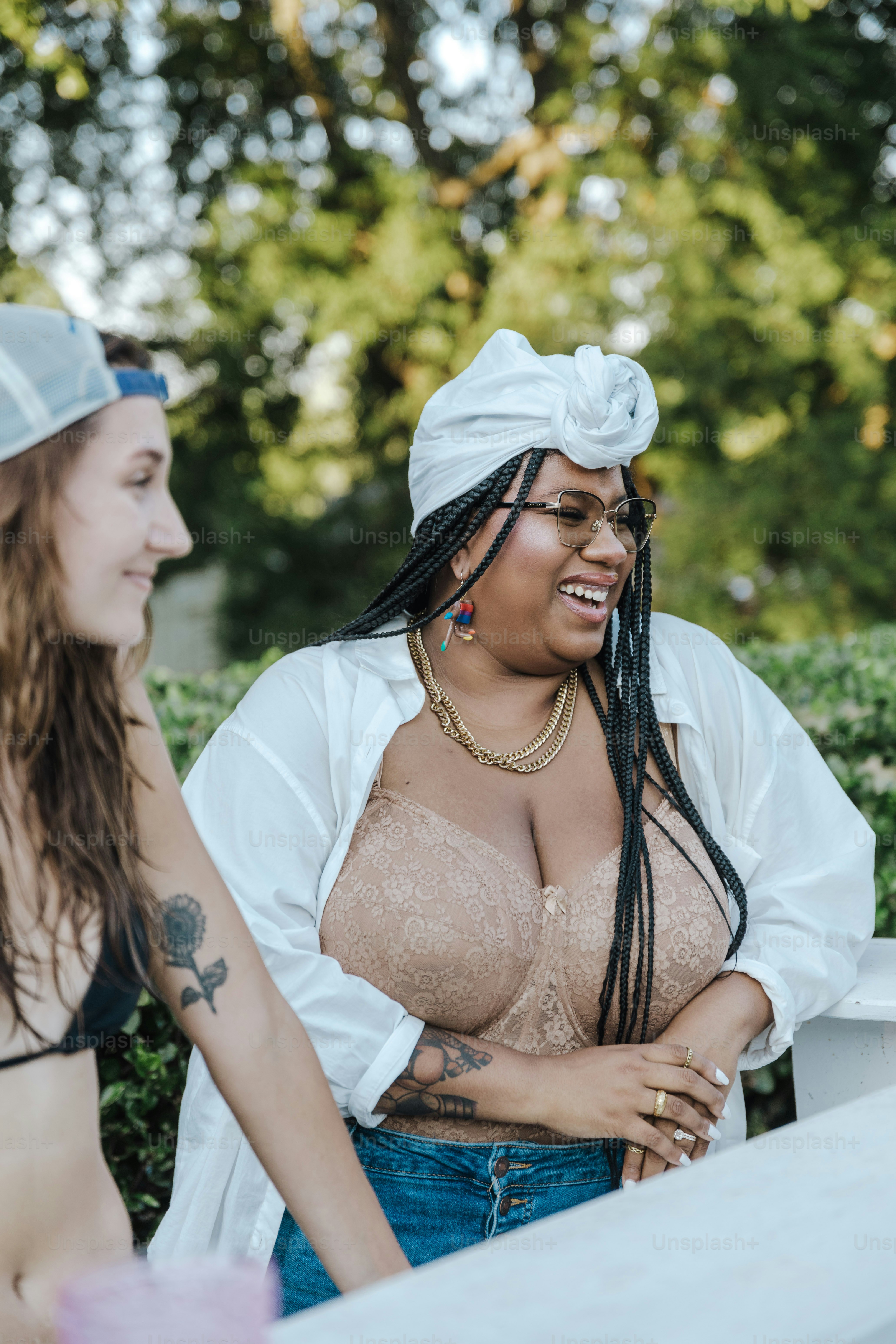 a woman in a white shirt and a woman in a black top