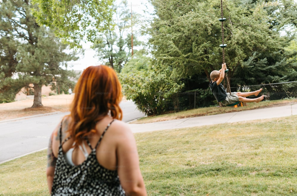 a woman is flying through the air on a skateboard