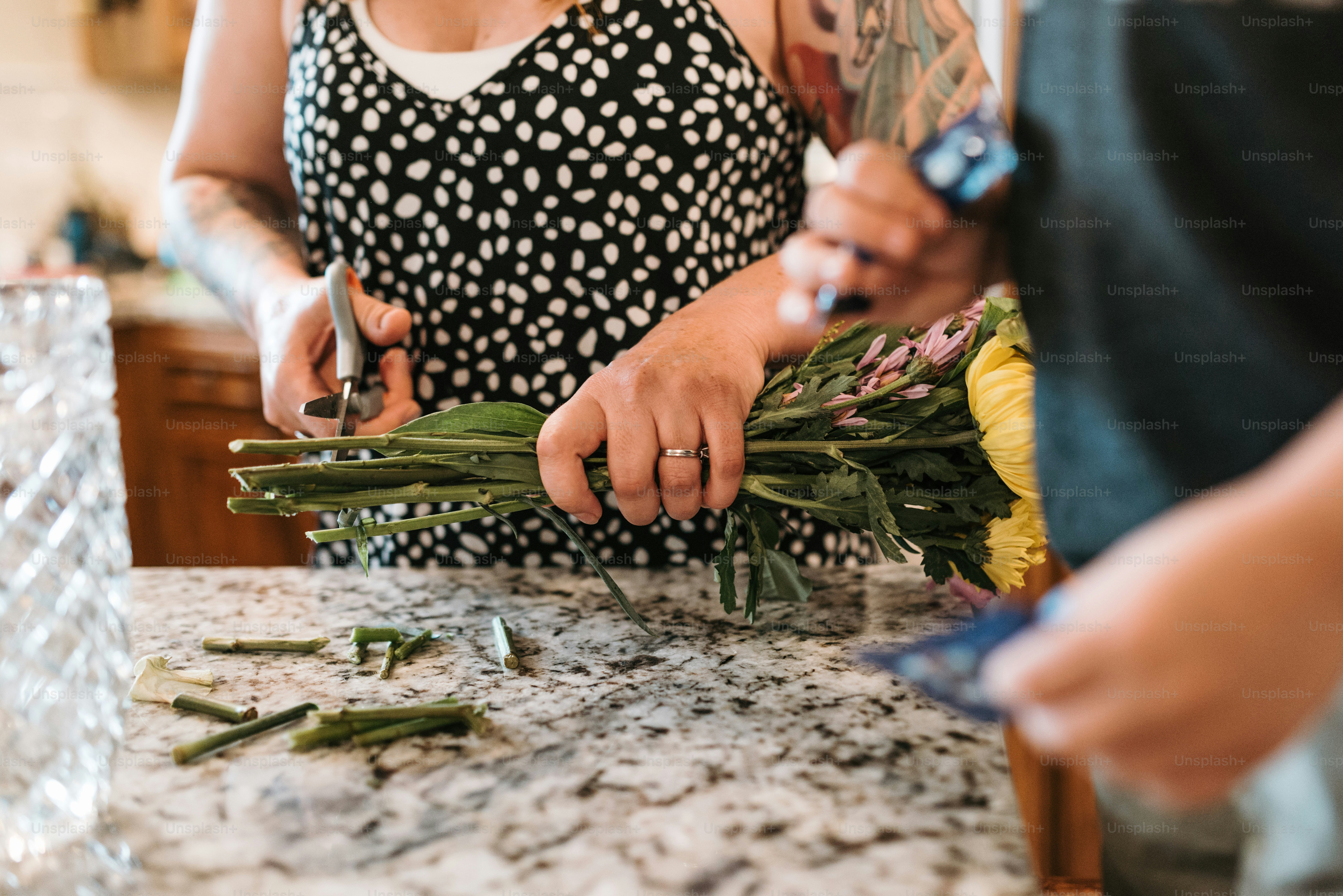 a couple of people that are standing in a kitchen