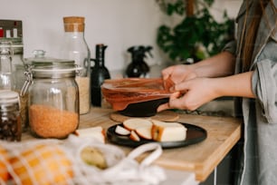 a woman is cutting apples on a cutting board