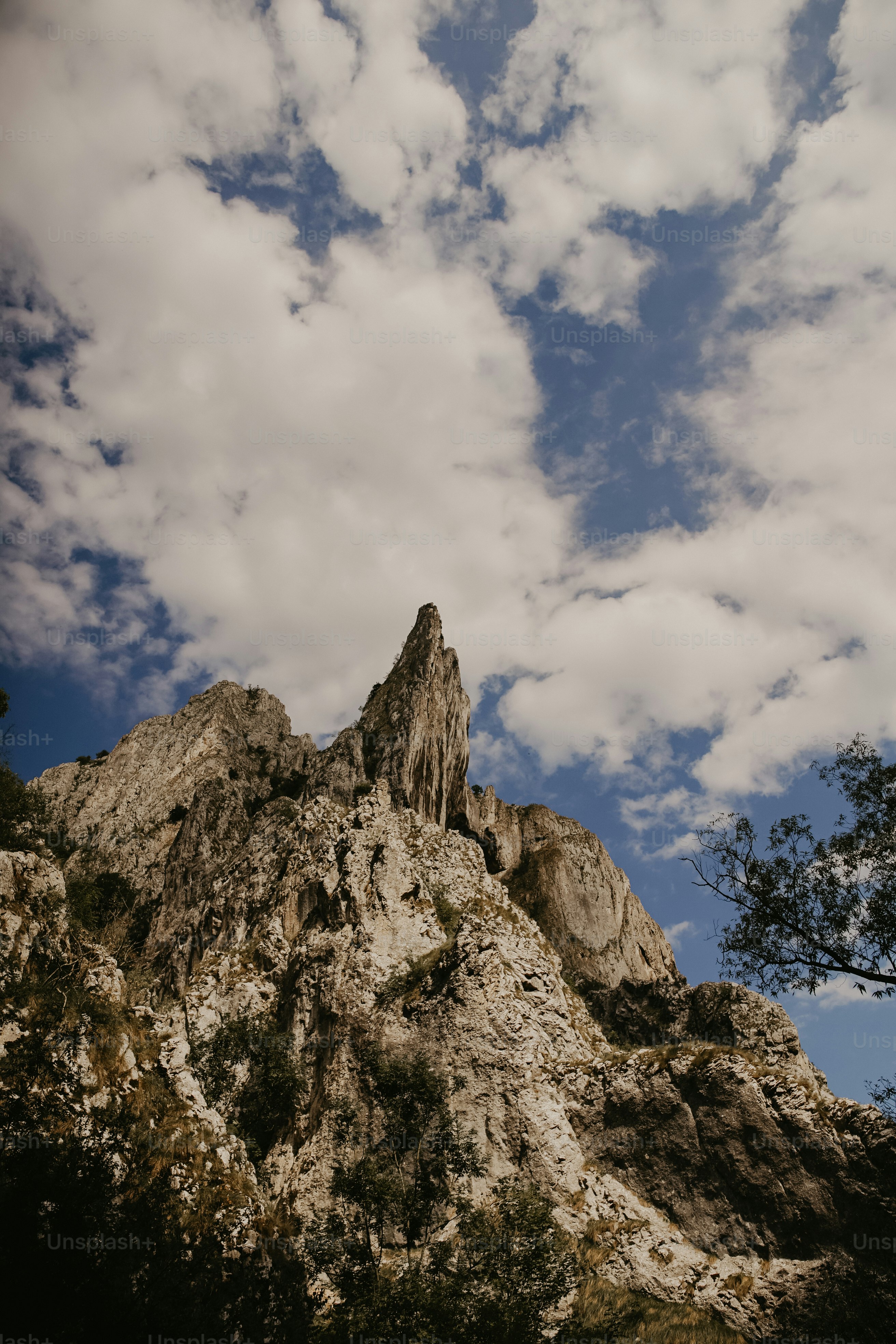 a very tall mountain with a very pretty sky in the background