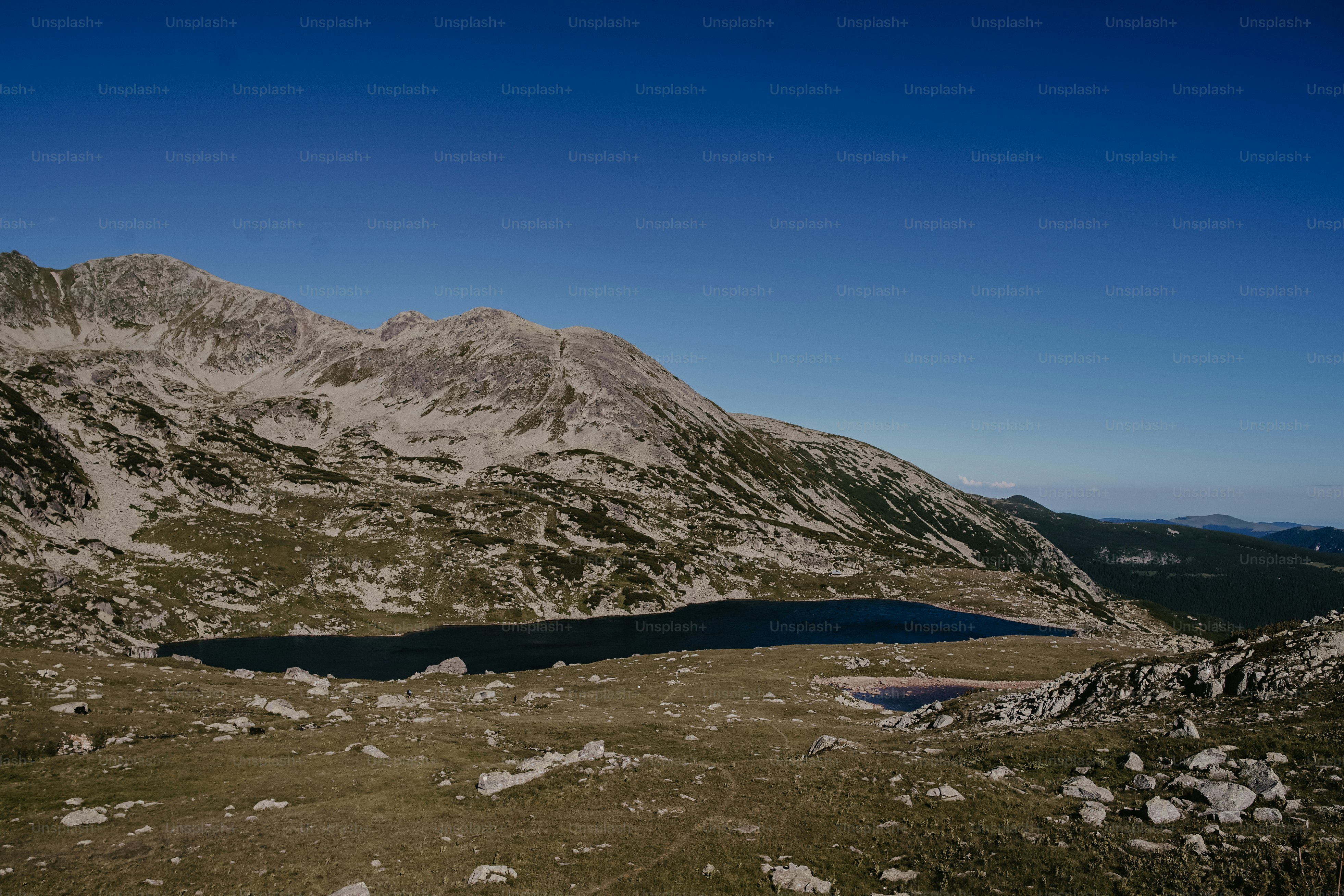 a mountain range with a lake in the middle