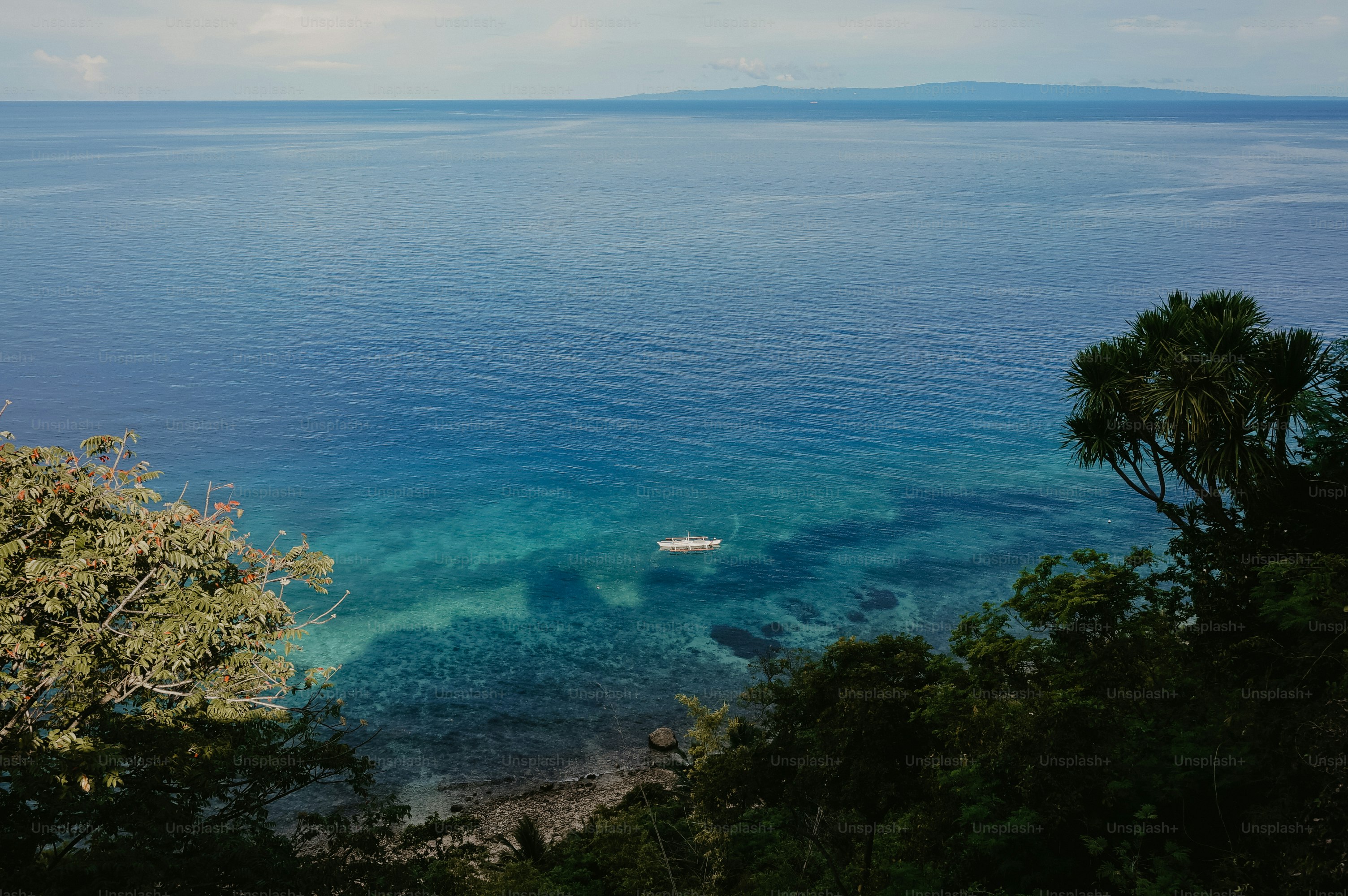 a boat floating on top of a body of water