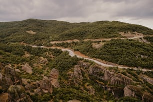 a winding road in the middle of a mountain