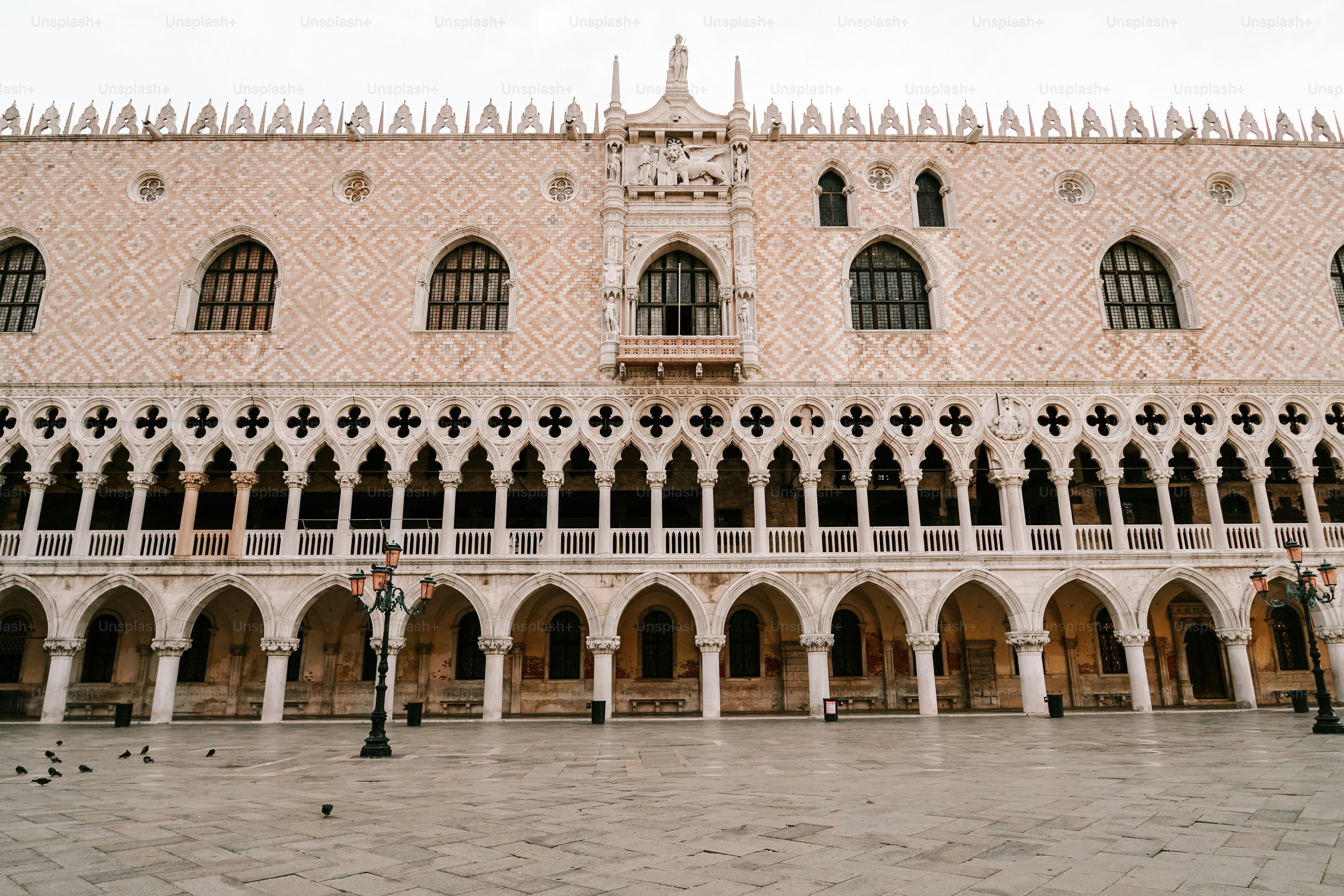 a large building with many windows and arches