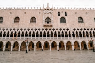 a large building with many windows and arches