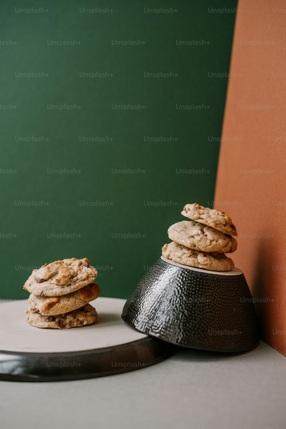 a stack of cookies sitting on top of a white plate