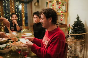 a group of people sitting around a table eating food