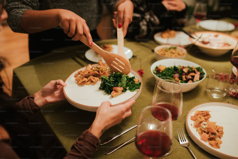 a group of people sitting around a table eating food