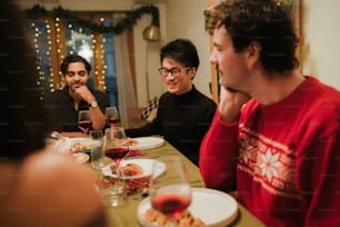 a group of people sitting around a dinner table