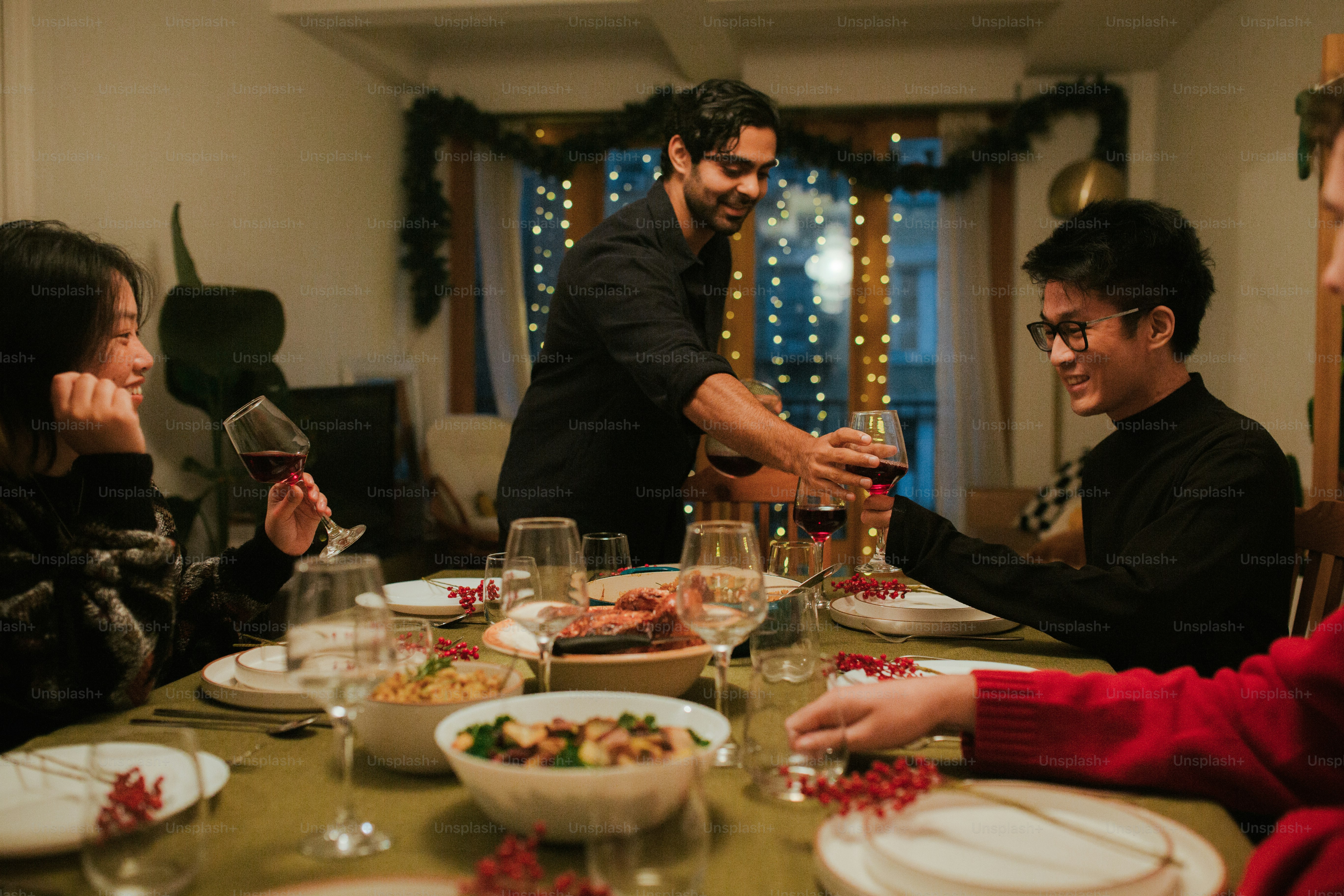 a group of people sitting around a dinner table