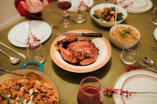 a table full of plates and bowls of food