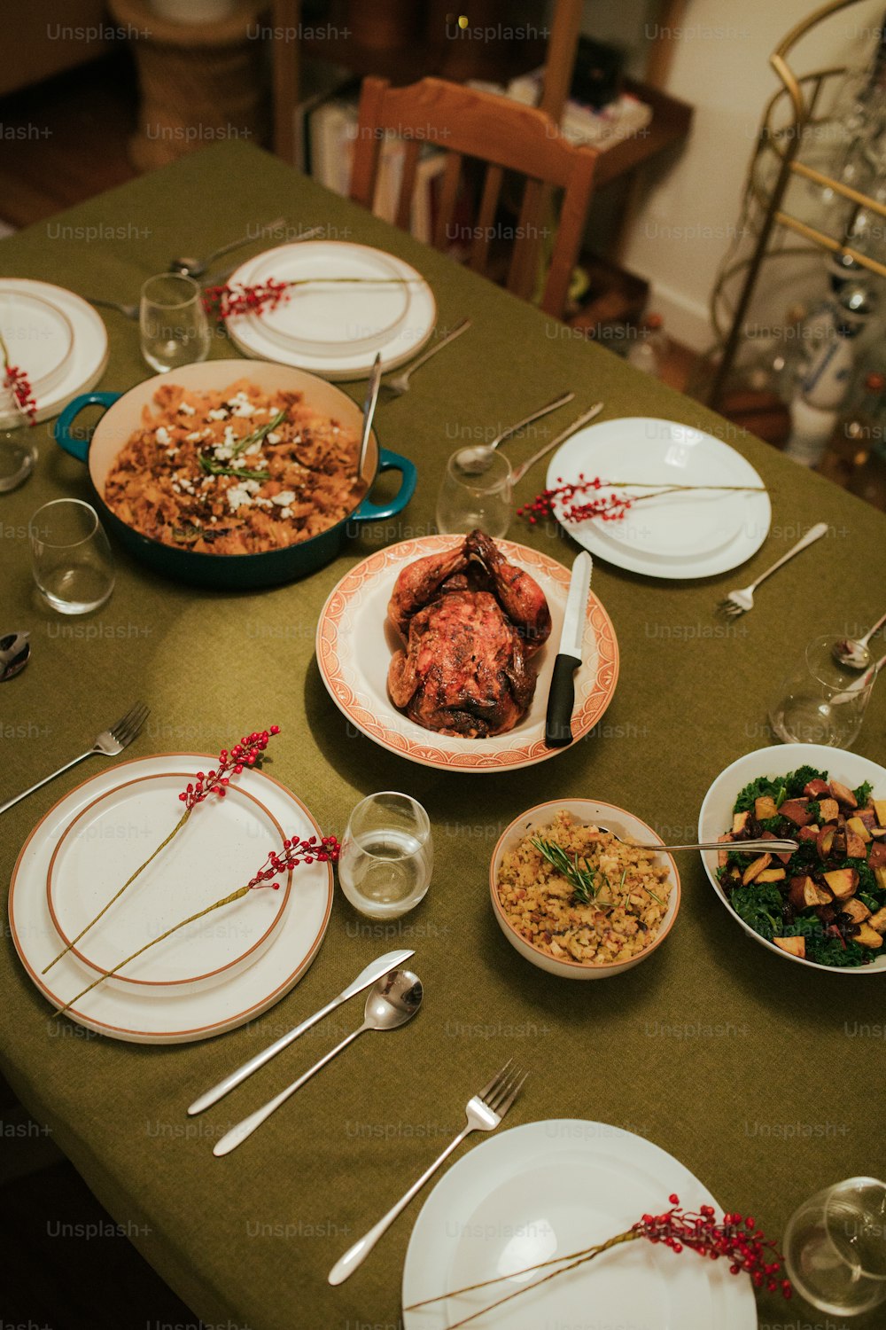 a table with plates of food and silverware on it