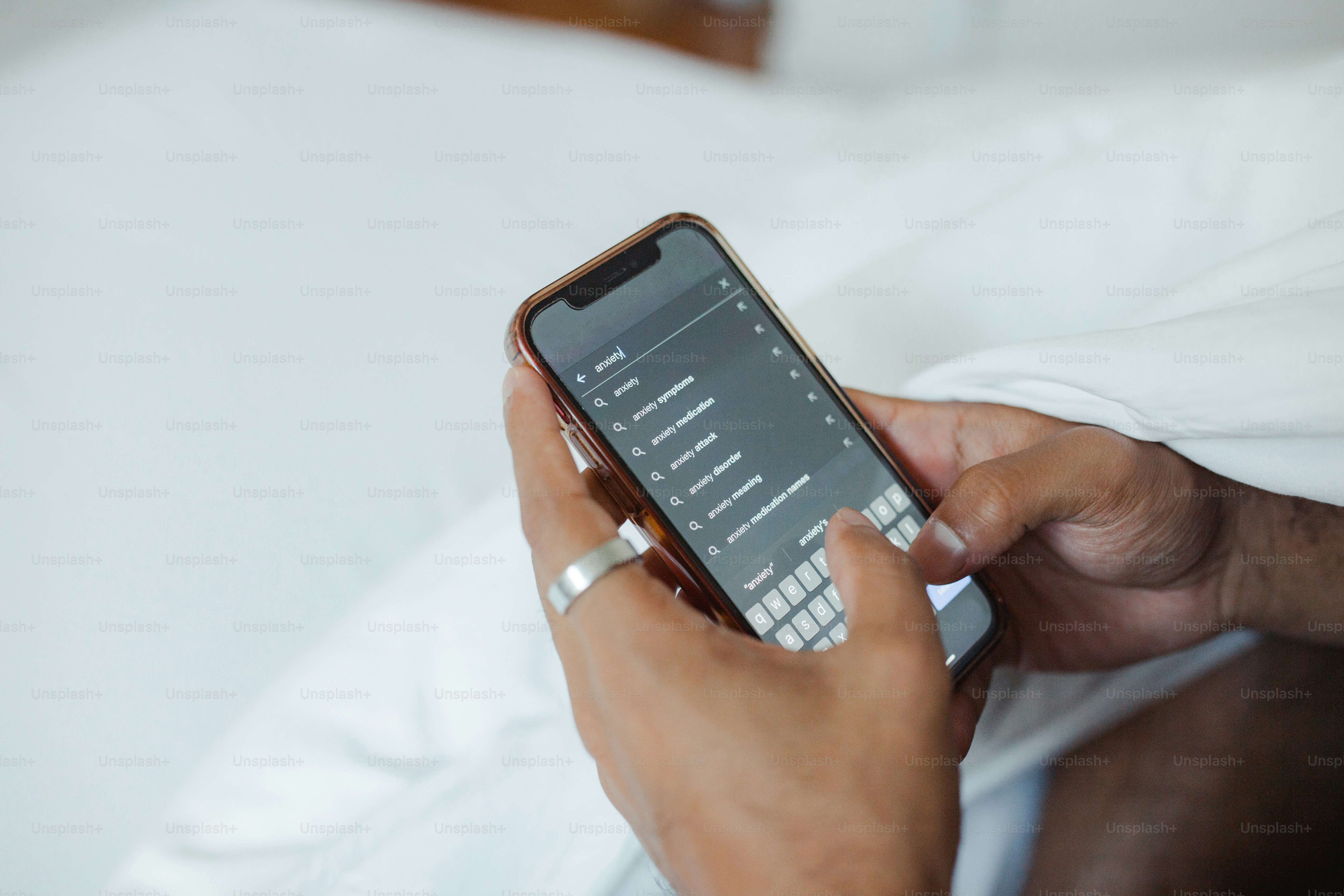 a person holding a cell phone in their hand