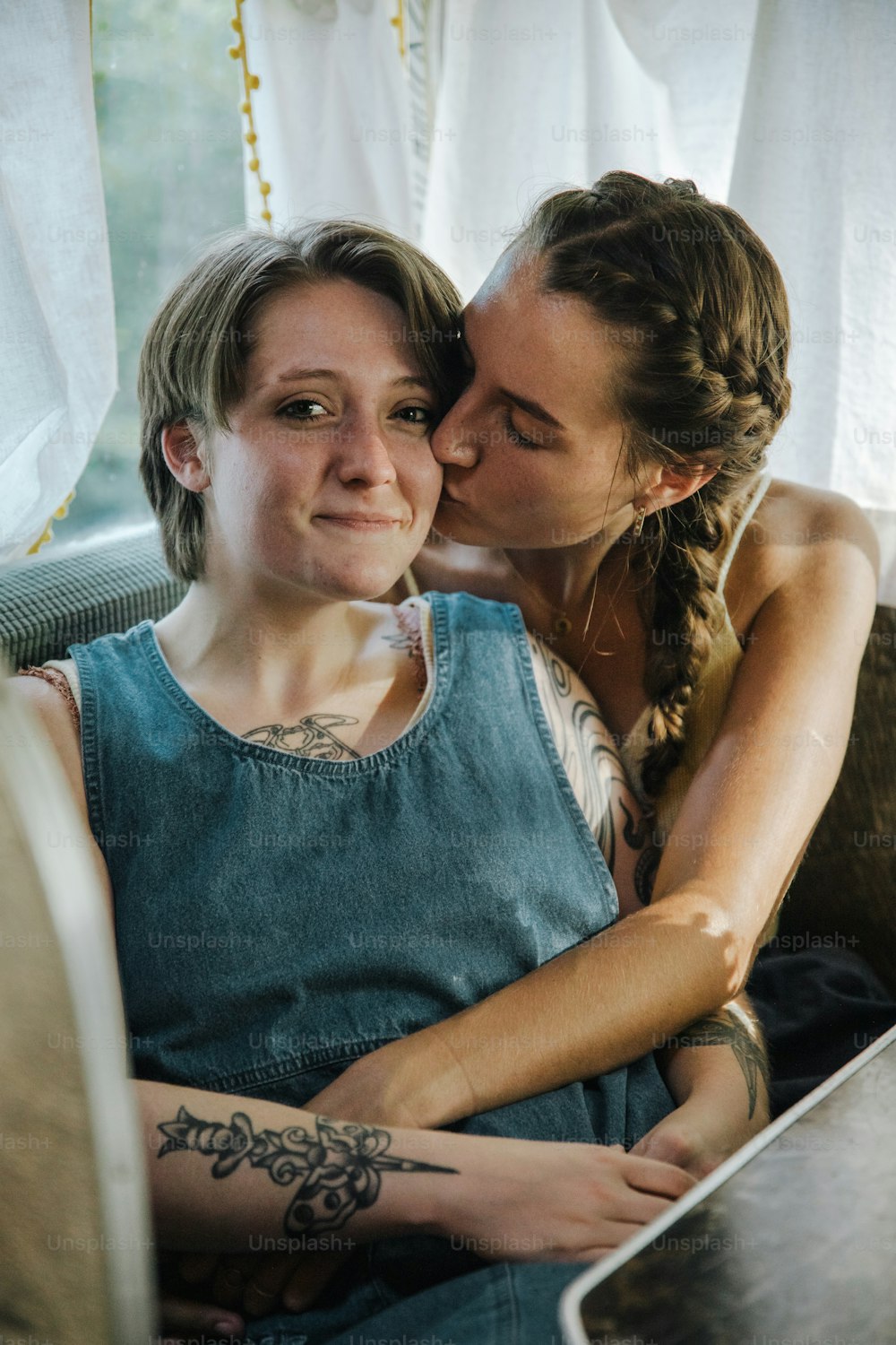 a couple of women sitting next to each other