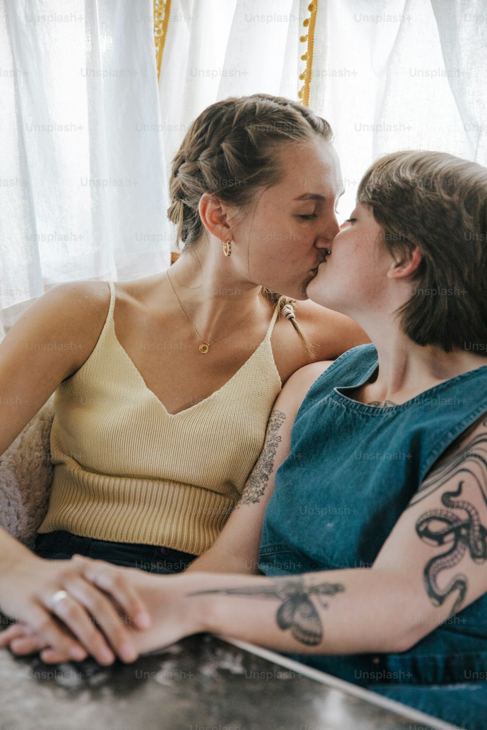 a couple of women sitting next to each other