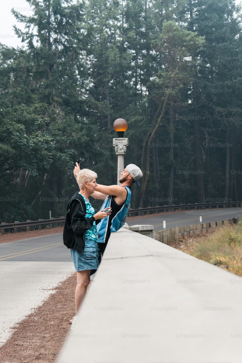 a man and a woman are playing with a ball