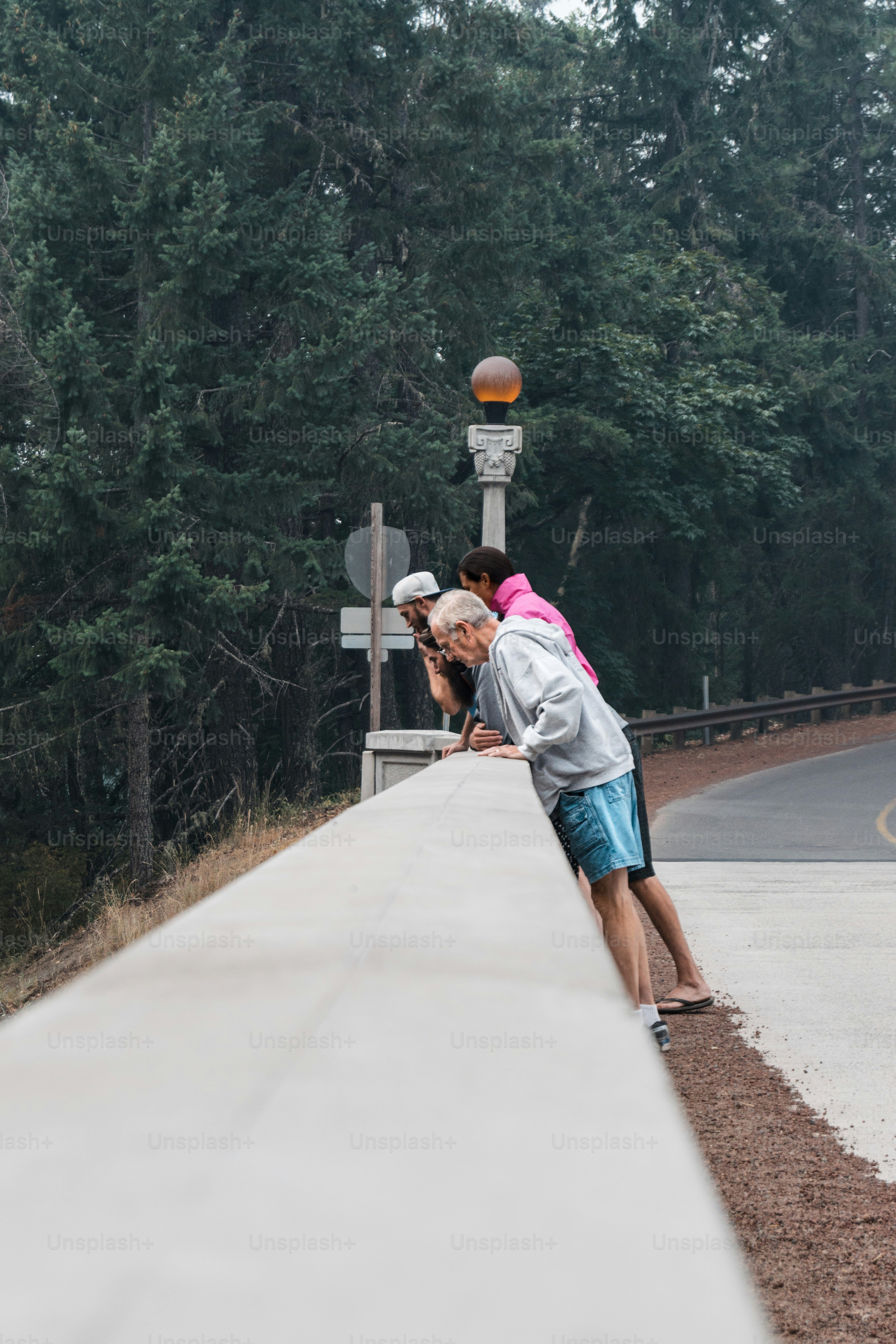 a couple of people that are standing on a road