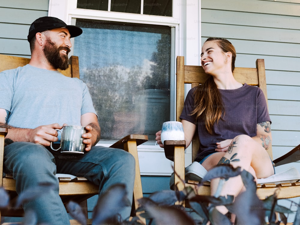 a man and a woman sitting on a porch