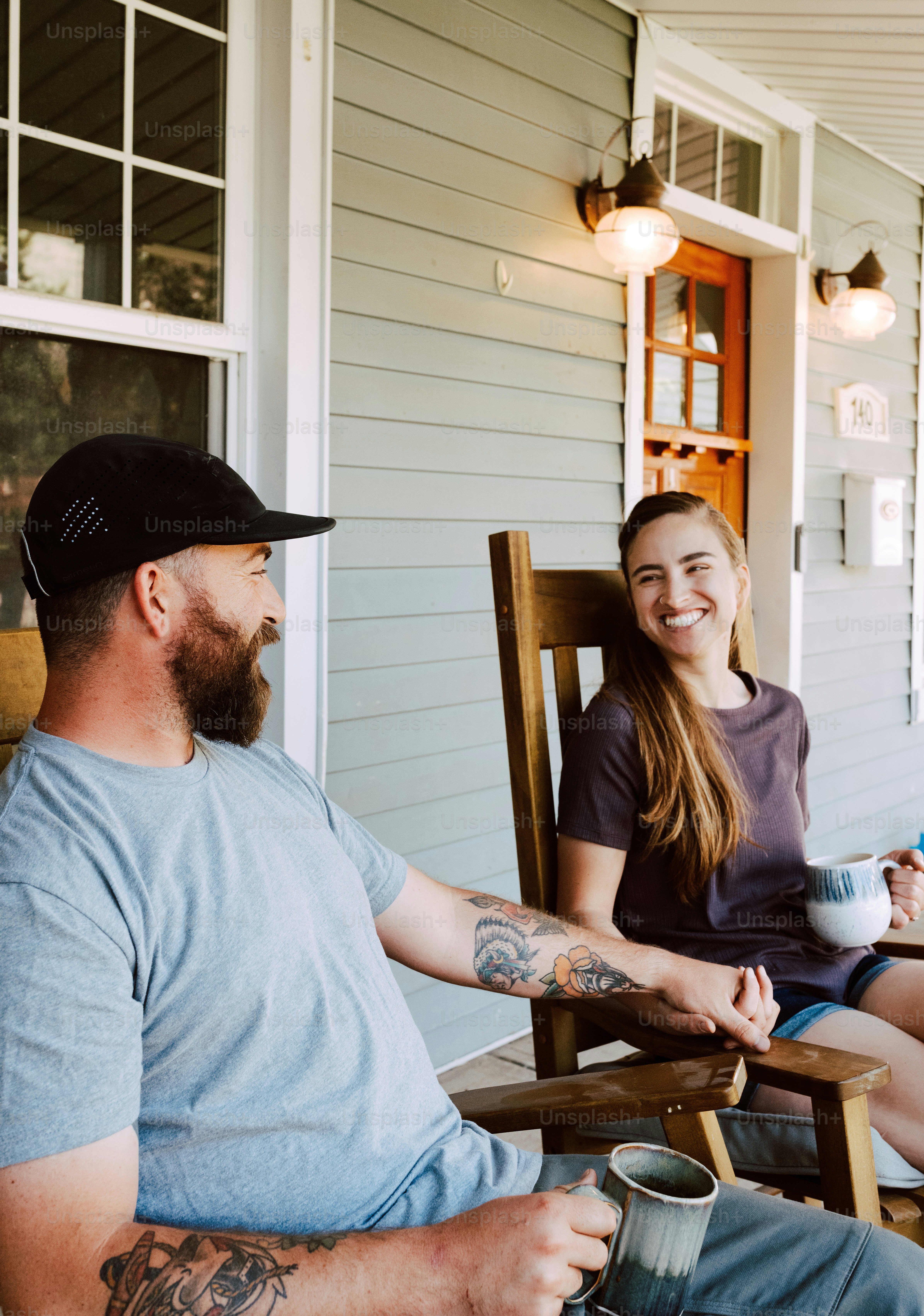 a man and a woman sitting on a porch