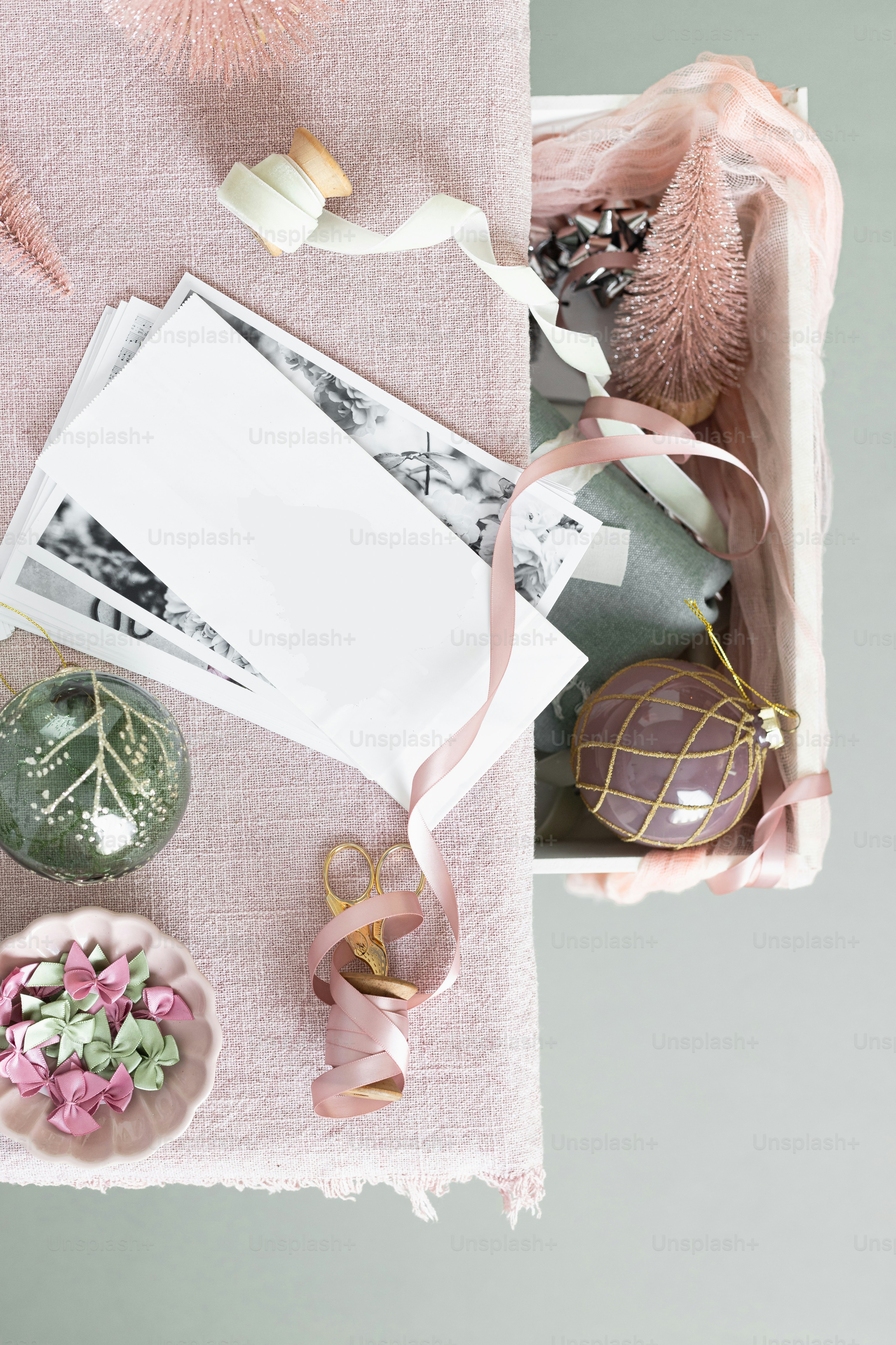 a pink table topped with lots of different items