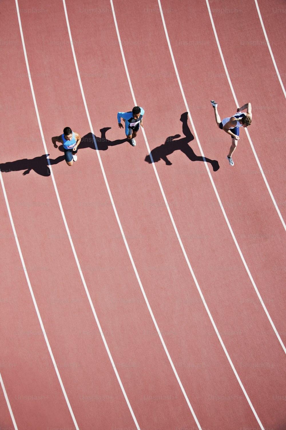 a group of people running on a track