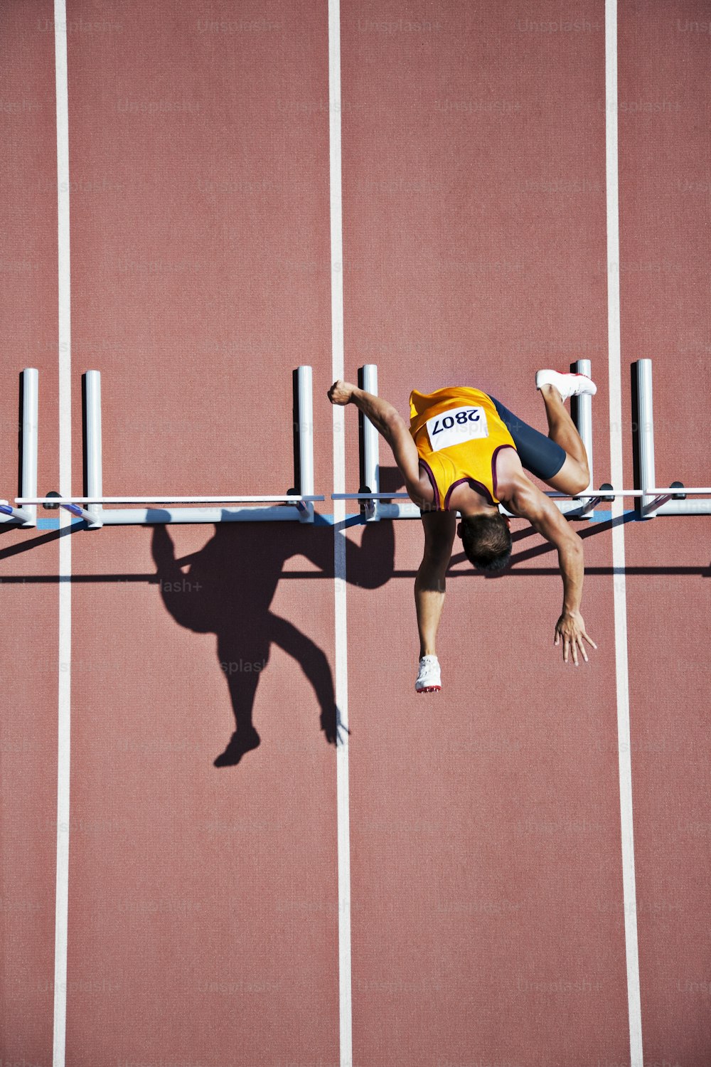 a man is doing a handstand on a track