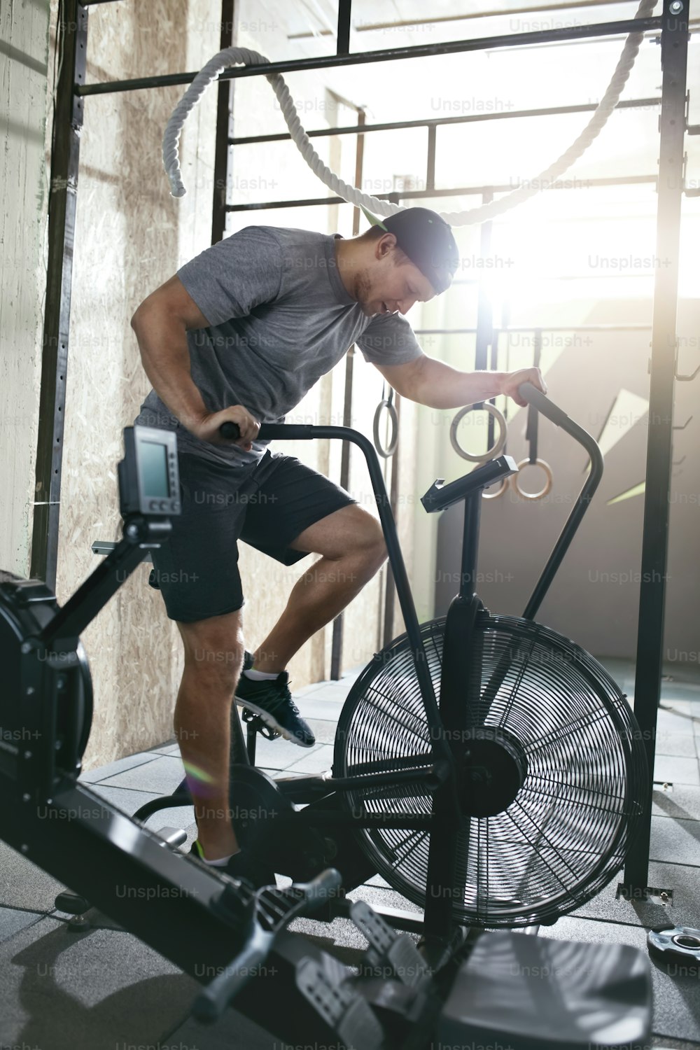 Cardio Workout. Sport  Man Training On Bicycle, Doing Cycling Exercise. High Resolution