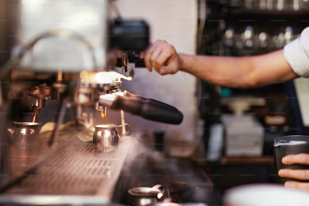 Preparing Drink In Coffee Machine By Barista At Cafe. Professional Equipment For Coffee Shop. High Resolution