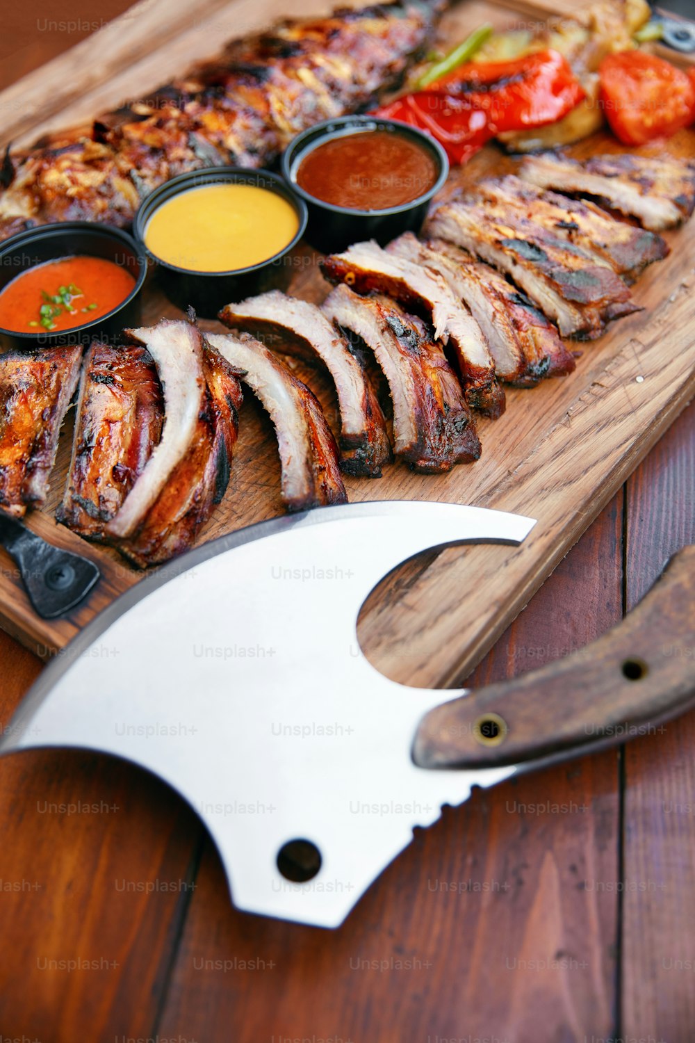 Food In Restaurant. Grill Ribs And Sauces On Wooden Tray. Ax For Cutting Pork Ribs. High Resolution