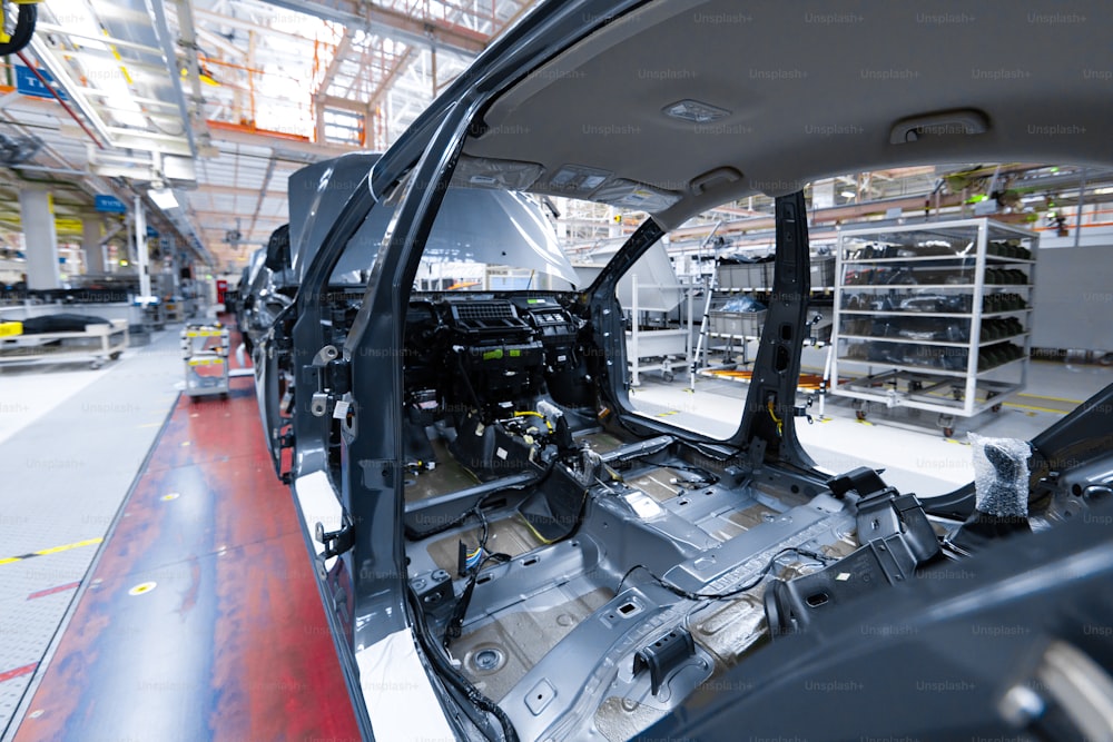 internal structure of car. Modern automobile production line, automated production equipment. Shop for Assembly of new modern cars. way of Assembly of the car on Assembly line at plant