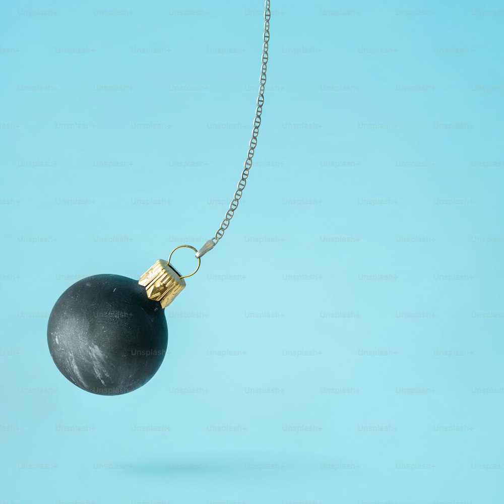 Black wrecking ball Christmas bauble decoration.