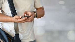 Cropped shot of man with mobile phone having conversation on mobile