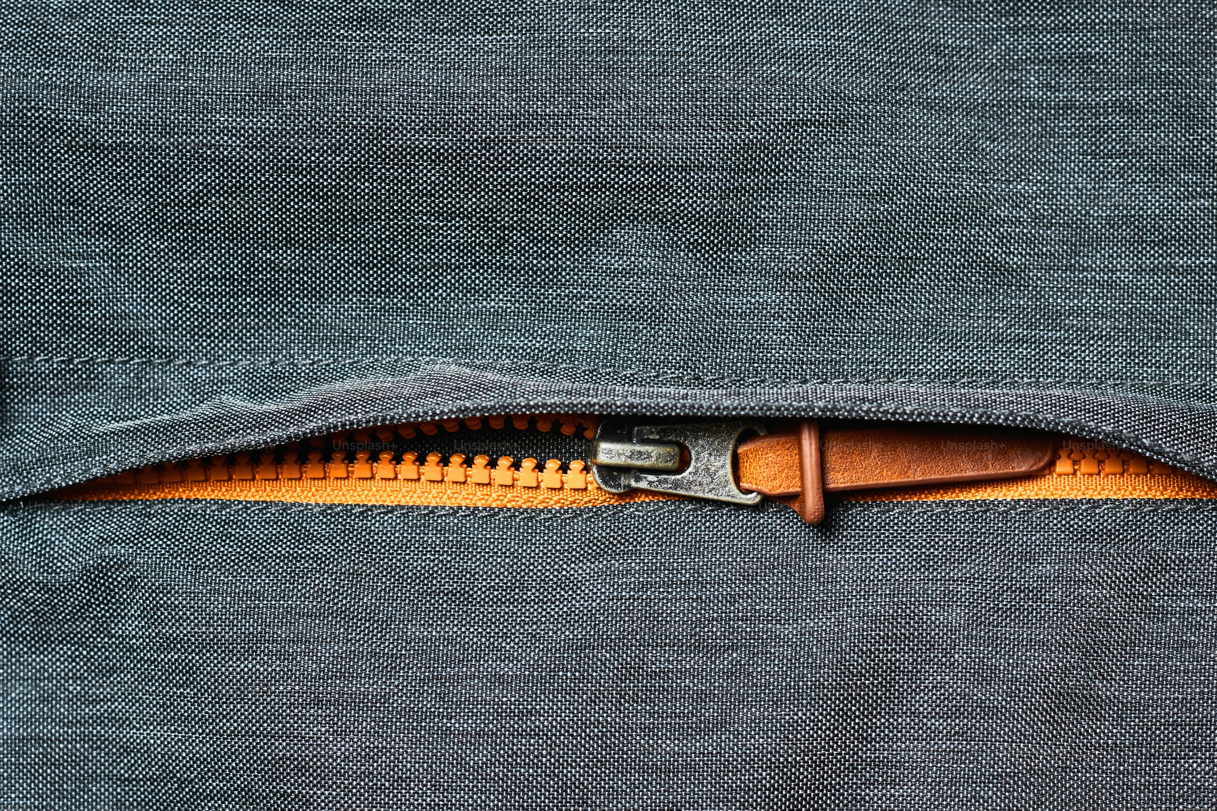 open zipper on jacket pocket, close up