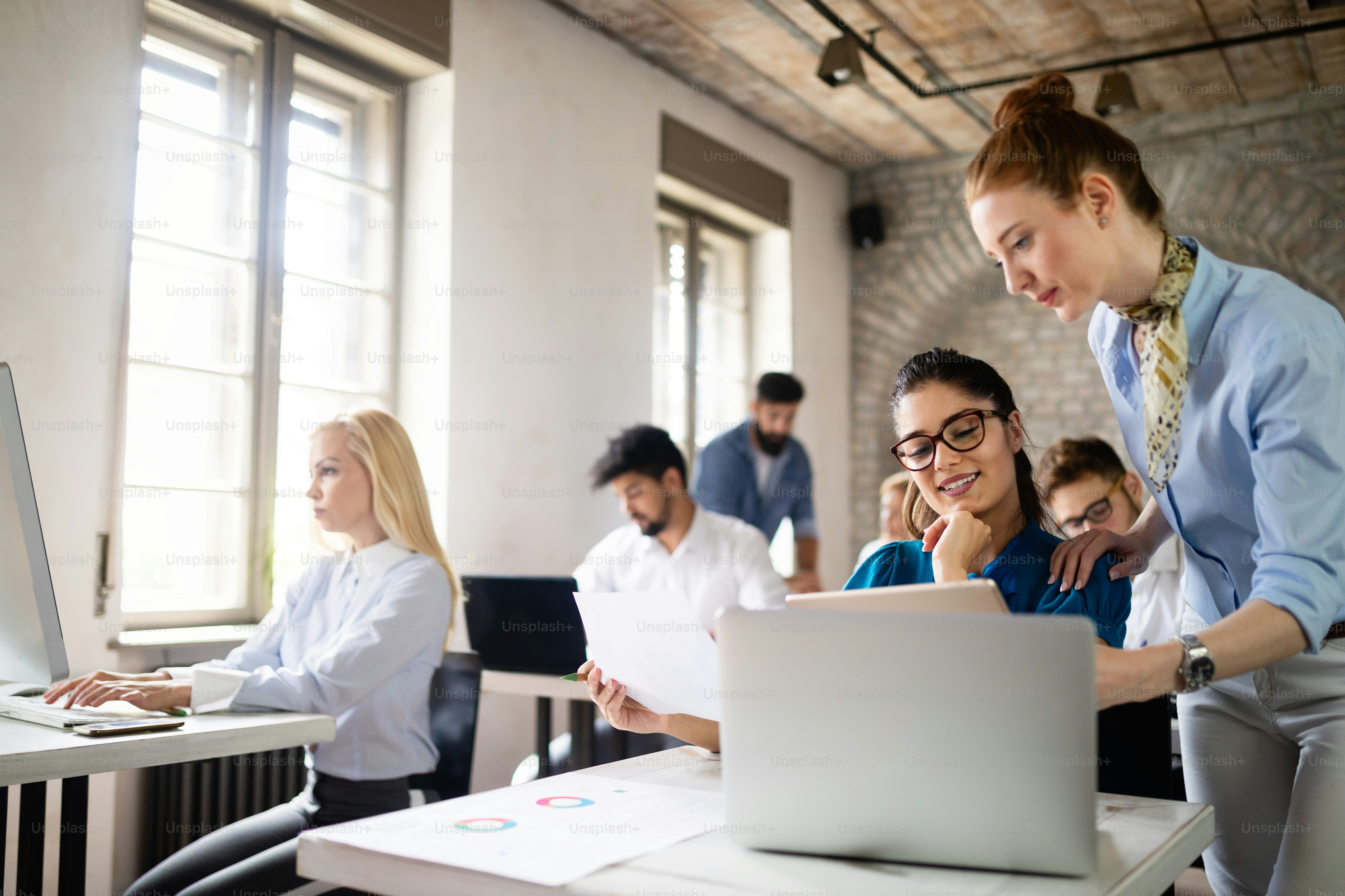 Successful happy group of students learning software engineering and business during presentation