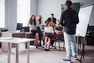 Successful business people are talking and smiling during in office