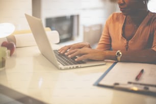 Take the weekend for a job. African American woman working at home.