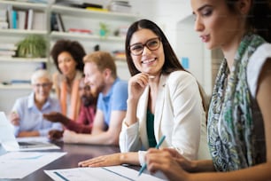 Successful group of business people at work in modern office