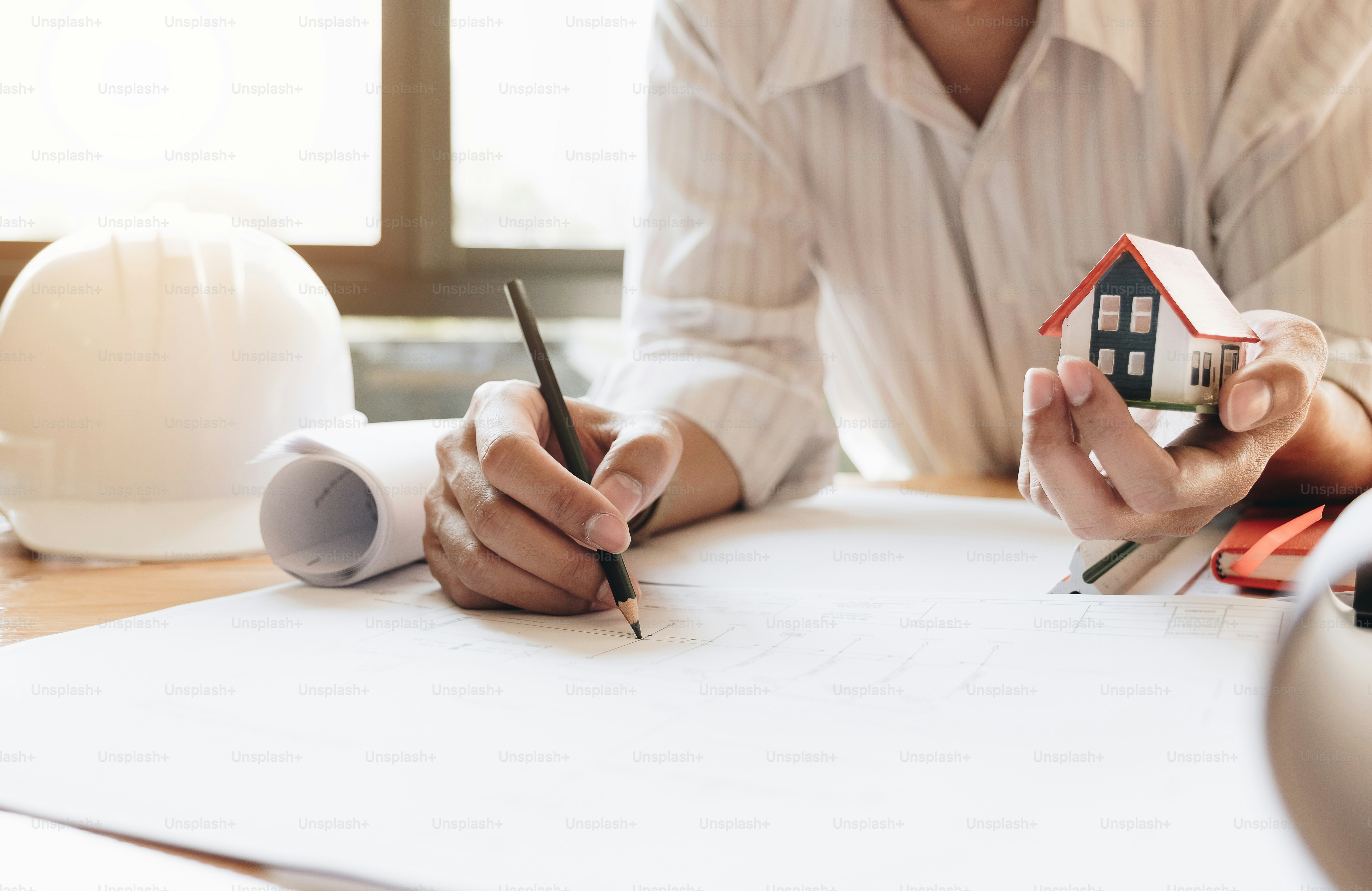 Construction engineering. Close up of engineers hands working on workplace photo Table Image