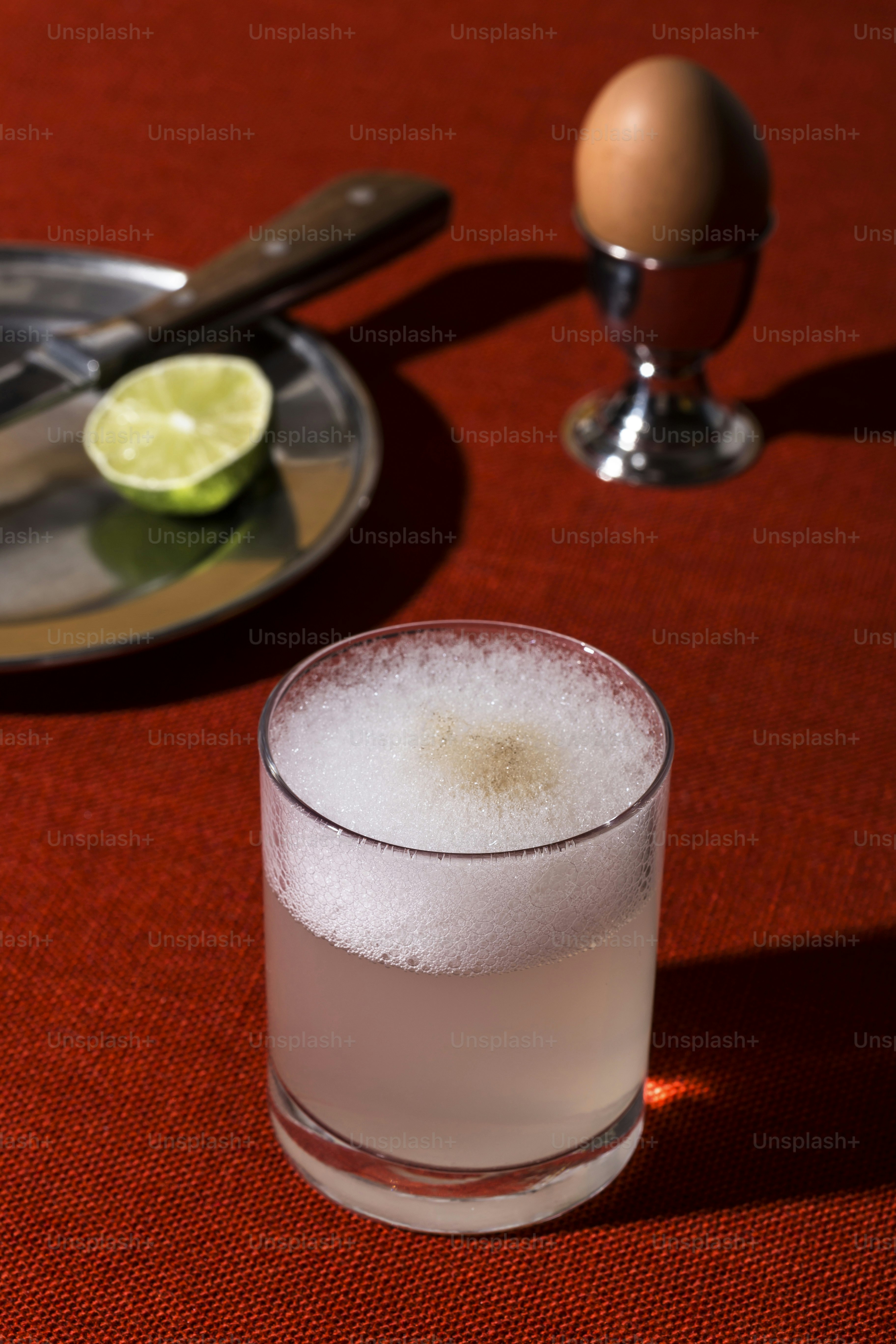 Mix the pisco, lime juice, simple syrup, and egg white in a cocktail shaker. Add ice to fill