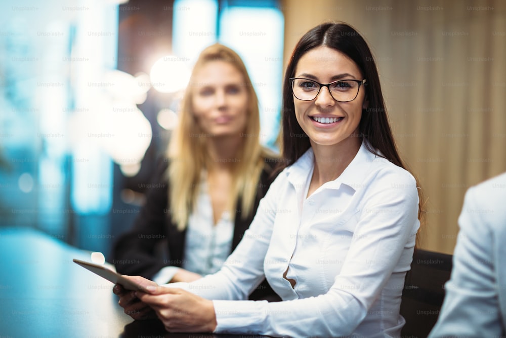 Picture of attractive smiling businesswoman in conference room