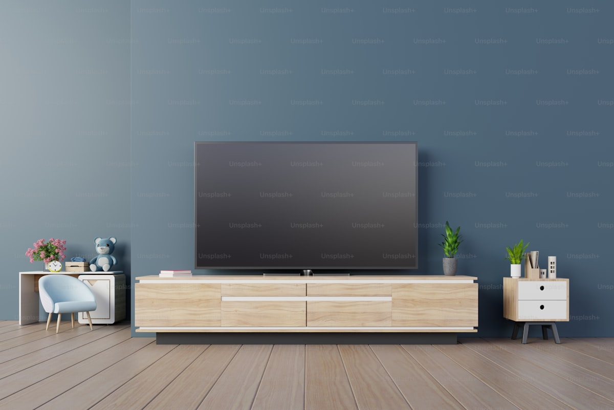 Tv design on cabinet interior modern room with plants,shelf,lamp on dark blue wall,3D rendering