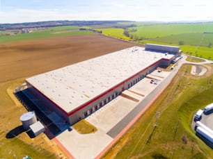 Aerial view of warehouse building in industrial district.