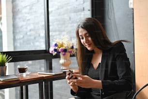 Secretary sexy women using mobile phone in business office.