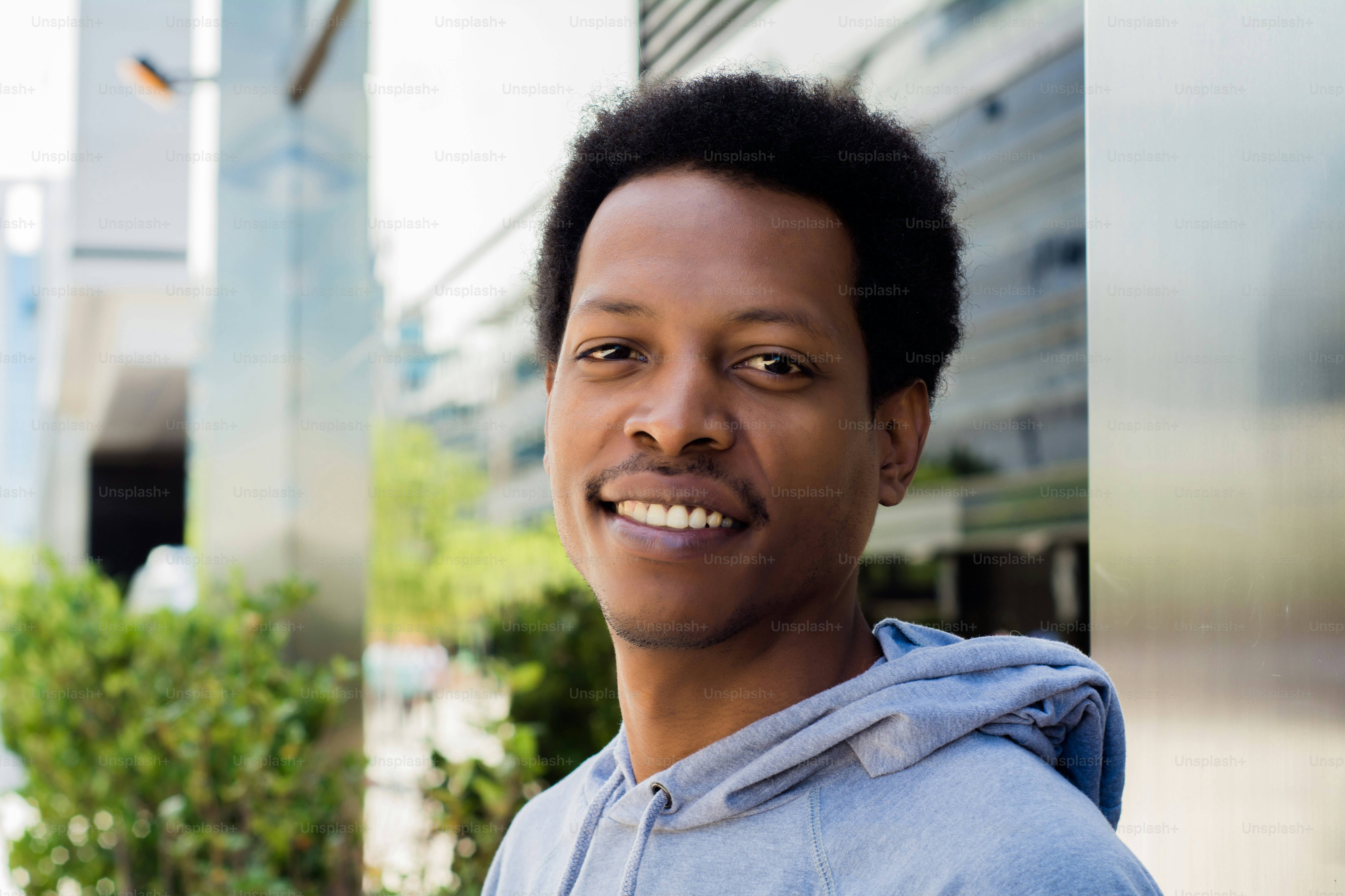 Portrait of young African American man in urban background.