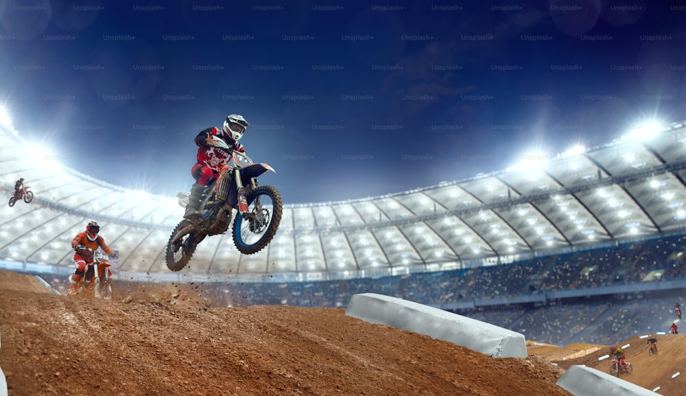 Motocross riders in action. Supercross. Motocross sport.