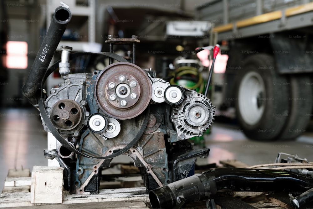 Part of mechanism or engine of large automobile inside technical repair workshop or hangar