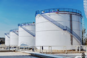 Picture of oil tanks at refinery. Sunny day.