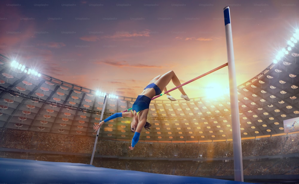 스포츠 선수권 대회에서 높은 점프를하는 운동 선수 여성.