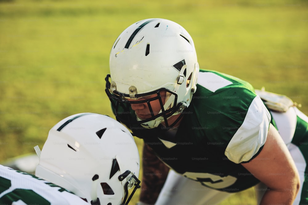 Two American football players lining up to do defence and tackling drills during a team practice